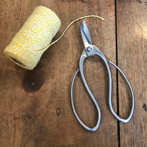 yellow and white bakers twine